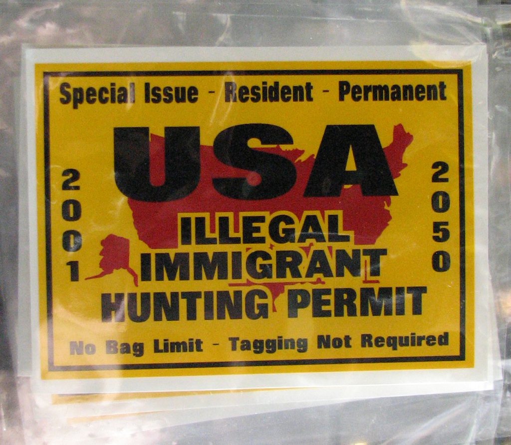 Anti-immigration sign reading "illegal immigrant hunting permit"